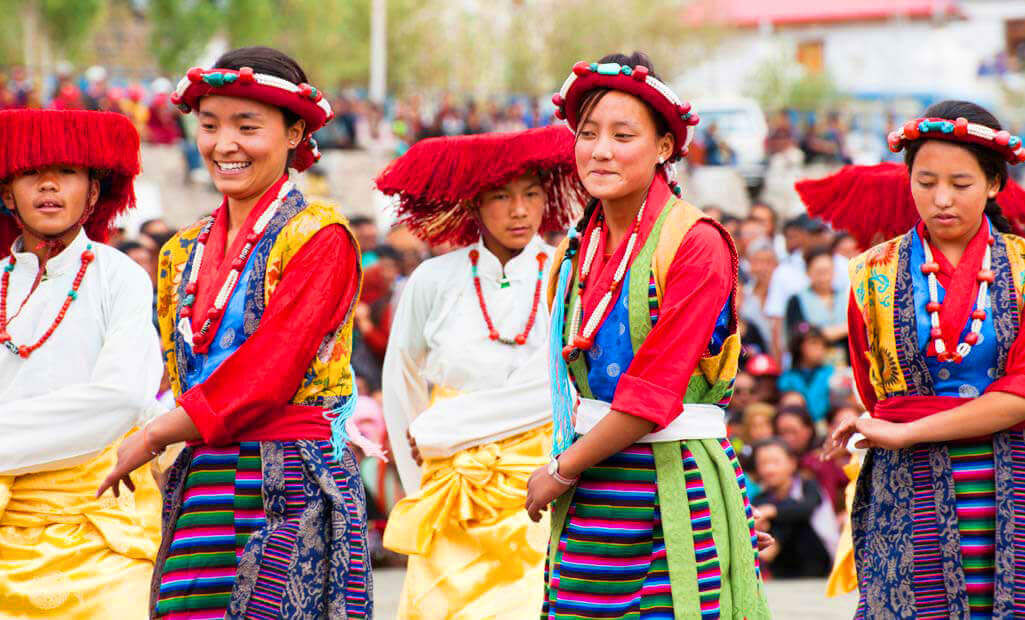 Ladakhi Cham mask dance performance at monastery with Himalayan backdrop